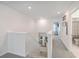 Upstairs hallway with grey carpet, white walls, and a view down the staircase at 612 S Pointe Blvd, Summerville, SC 29483