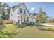 Two-story farmhouse style home with landscaped yard at 612 S Pointe Blvd, Summerville, SC 29483