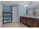 Bathroom with double vanity and storage shelves at 316 Bay Village Ln, Moncks Corner, SC 29461