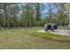 Backyard with patio, seating area and wooded backdrop at 316 Bay Village Ln, Moncks Corner, SC 29461