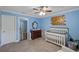 Bright Bedroom with crib, dresser, and charming wall decor at 316 Bay Village Ln, Moncks Corner, SC 29461