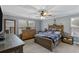 Main bedroom with rustic wood furniture and large windows at 316 Bay Village Ln, Moncks Corner, SC 29461