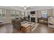 Bright living room featuring a fireplace and comfortable leather seating at 316 Bay Village Ln, Moncks Corner, SC 29461