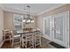 Kitchen dining area with table and chairs, and access to the backyard at 316 Bay Village Ln, Moncks Corner, SC 29461