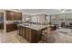 Spacious kitchen with large island, granite countertops, and dark wood cabinets at 316 Bay Village Ln, Moncks Corner, SC 29461