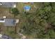 Aerial view showing home, pool, and surrounding treeline at 316 Bay Village Ln, Moncks Corner, SC 29461