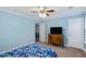 Bedroom with a TV, dresser and blue floral bedding at 316 Bay Village Ln, Moncks Corner, SC 29461