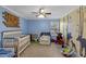 Charming Bedroom with whimsical wall mural and crib at 316 Bay Village Ln, Moncks Corner, SC 29461