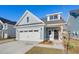Charming craftsman style home with two-car garage and nicely landscaped yard at 425 Grove End Rd, Moncks Corner, SC 29461