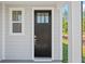 Modern black front door with glass panels and sidelight at 425 Grove End Rd, Moncks Corner, SC 29461