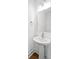 Modern powder room featuring a pedestal sink and sleek mirror at 425 Grove End Rd, Moncks Corner, SC 29461