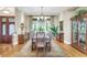 Formal dining room with hardwood floors, large windows, and a beautiful chandelier at 11 Falcon Point Rd, Kiawah Island, SC 29455