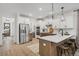 Modern kitchen with stainless steel appliances, an island, and breakfast bar at 416 Grove End Rd, Moncks Corner, SC 29461