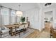 Bright dining room featuring a wooden table, neutral decor, and hardwood floors at 416 Grove End Rd, Moncks Corner, SC 29461