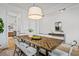 Bright dining room featuring a rustic wood table with six chairs, and view into the kitchen at 416 Grove End Rd, Moncks Corner, SC 29461