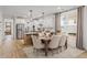 Bright kitchen features island, stainless steel appliances, and dining area at 416 Grove End Rd, Moncks Corner, SC 29461