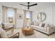 Bright bonus room with seating area and large windows at 416 Grove End Rd, Moncks Corner, SC 29461