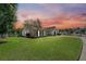 House exterior view at sunset with a well-maintained lawn at 127 Alcester Rd, Goose Creek, SC 29445