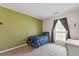 Cozy bedroom with a twin-size bed and green accent wall at 127 Alcester Rd, Goose Creek, SC 29445