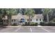 Community pool house with a white exterior and palm trees at 258 Kelsey Blvd, Wando, SC 29492