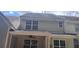 Rear exterior showing second story windows and covered patio at 258 Kelsey Blvd, Wando, SC 29492