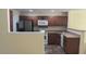 Modern kitchen with wood cabinets, stainless steel appliances, and tile flooring at 258 Kelsey Blvd, Wando, SC 29492