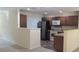 Kitchen features a breakfast bar, stainless steel appliances, and wood cabinets at 258 Kelsey Blvd, Wando, SC 29492