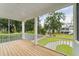 Screened porch with wooden deck overlooking backyard and trees at 1663 Cultivation Ln # 455, Mount Pleasant, SC 29466