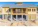 New clubhouse under construction with metal roof and large deck at 1663 Cultivation Ln # 455, Mount Pleasant, SC 29466