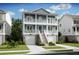 Two-story home with light blue siding and a front porch at 1663 Cultivation Ln # 455, Mount Pleasant, SC 29466