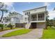 Two story home with gray and white exterior, driveway and landscaping at 1663 Cultivation Ln # 455, Mount Pleasant, SC 29466