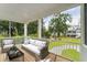 Relaxing screened porch furnished with wicker sofa and chairs at 1663 Cultivation Ln # 455, Mount Pleasant, SC 29466
