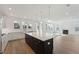 Open concept kitchen with large island and hardwood floors at 1663 Cultivation Ln # 455, Mount Pleasant, SC 29466