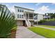 Two story home with white exterior, driveway and landscaping at 1663 Cultivation Ln # 455, Mount Pleasant, SC 29466