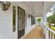 Front porch with dark door and wood flooring at 1663 Cultivation Ln # 455, Mount Pleasant, SC 29466