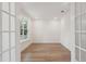 Bright office with hardwood floors, built-in shelving, and a large window at 1663 Cultivation Ln # 455, Mount Pleasant, SC 29466