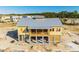 New clubhouse under construction with metal roof and large deck at 1663 Cultivation Ln # 455, Mount Pleasant, SC 29466