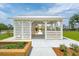White gazebo with wooden benches and metal roof at 1668 Siloh Dr # 470, Mount Pleasant, SC 29466