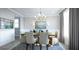 Bright dining room with rectangular table and elegant chandelier at 1668 Siloh Dr # 470, Mount Pleasant, SC 29466