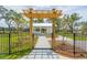 Wooden pergola leading to a white gazebo with a walkway at 1668 Siloh Dr # 470, Mount Pleasant, SC 29466
