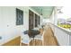 Screened porch with tables, chairs, and views of community at 1668 Siloh Dr # 470, Mount Pleasant, SC 29466