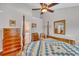 Bright bedroom with a post bed, hardwood floors, and ensuite bathroom access at 2851 Curran Pl, Mount Pleasant, SC 29466