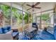 Relaxing sunroom with wicker furniture and view of lush greenery at 2851 Curran Pl, Mount Pleasant, SC 29466