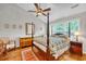 Main bedroom with a large bed, hardwood floors, and plenty of natural light at 2851 Curran Pl, Mount Pleasant, SC 29466