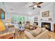 Bright living room features hardwood floors, a fireplace, and ample natural light at 2851 Curran Pl, Mount Pleasant, SC 29466