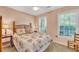 Comfortable bedroom with a queen bed and plenty of natural light at 2851 Curran Pl, Mount Pleasant, SC 29466