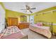Cozy bedroom with twin beds, cheerful walls, and built-in shelves at 2851 Curran Pl, Mount Pleasant, SC 29466