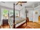Spacious bedroom with a post bed, hardwood floors, and ample natural light at 2851 Curran Pl, Mount Pleasant, SC 29466