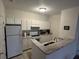 Efficient kitchen with granite counters and white cabinets at 1600 Long Grove Dr # 628, Mount Pleasant, SC 29464
