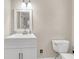 Small bathroom with white vanity, toilet, and neutral color palette at 598 Maple Branch Rd, Reevesville, SC 29471